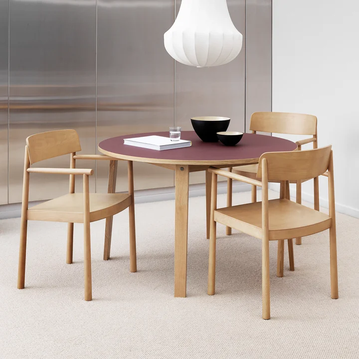 The Timb armchair from Normann Copenhagen at the round dining table
