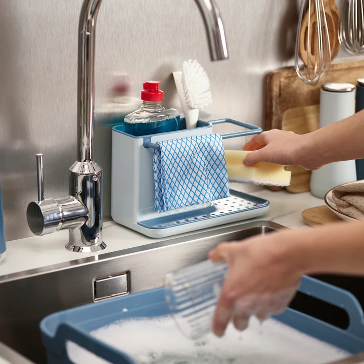 The Caddy utensil container from Joseph Joseph with brushes, bottles and wipes