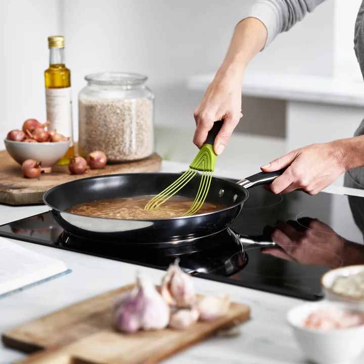The flat Twist Whisk from Joseph Joseph when stirring a sauce