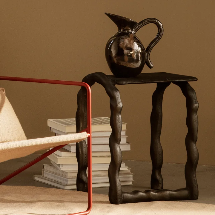The Verso carafe by Ferm Living on a rustic side table