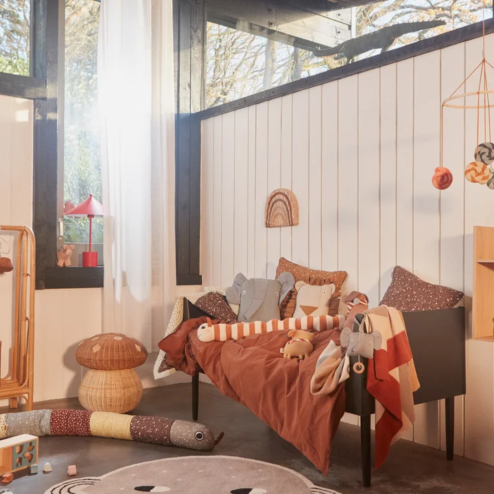 The Denim children's pillow from OYOY in a cute crib