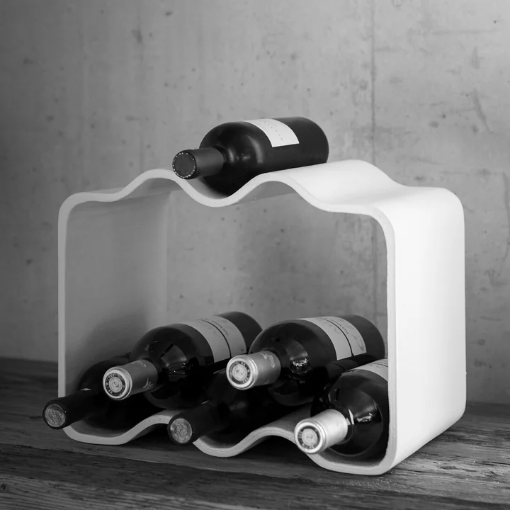 The curved shapes of the Cheers wine rack by Eternit