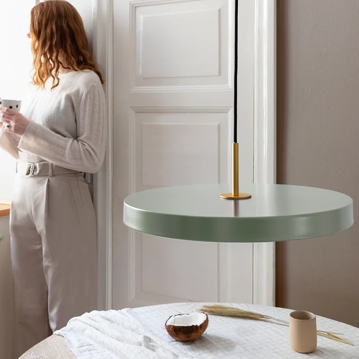 The Asteria Pendant light from Umage above the dining table