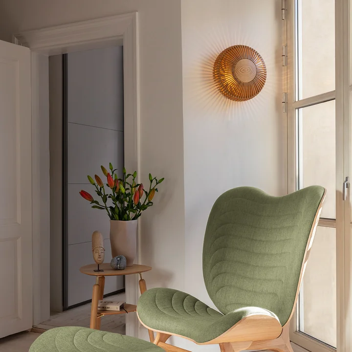 The Clava Up Wood lampshade from Umage on a narrow wall