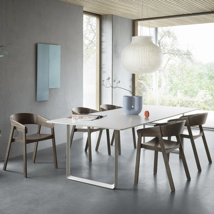 Several Cover Armchairs from Muuto at a large, bright table