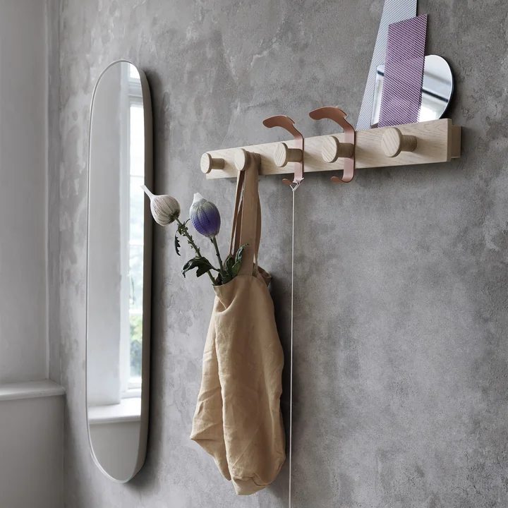 The coat rack and Framed Mirror Large from Muuto in the modern hallway