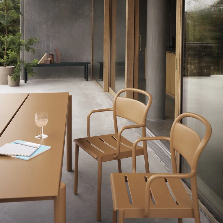The Linear Steel Armchair from Muuto at the Linear Steel table on the terrace