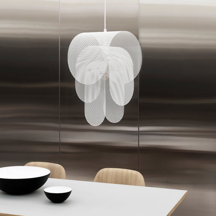 The Superpose pendant light from Normann Copenhagen above a dining table