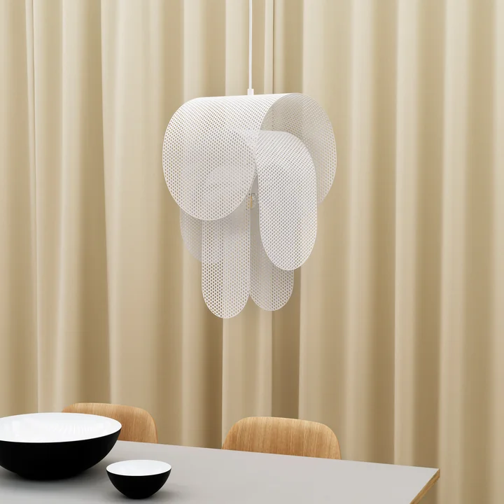 The Superpose pendant luminaire from Normann Copenhagen appears semi-transparent.