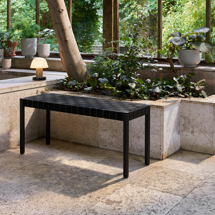 The Betty TK4 bench small from & Tradition on a stone terrace