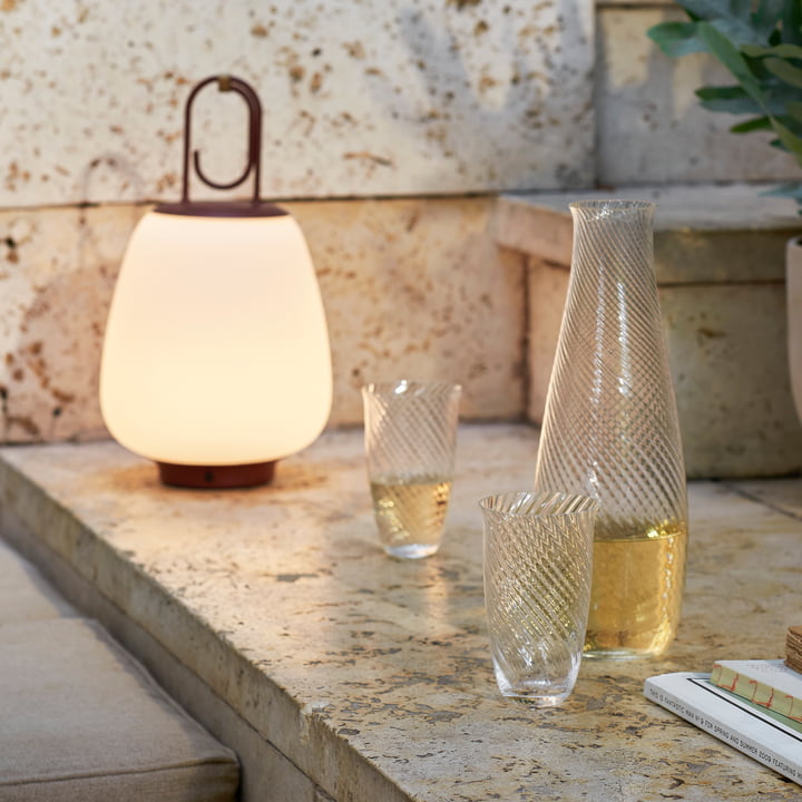 The Lucca lamp and the Collect glasses from & Tradition on a stone bench