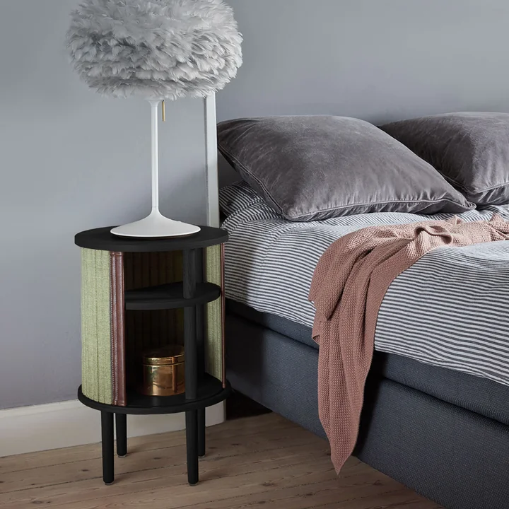 The Audacious side table from Umage as a bedside table next to the bed