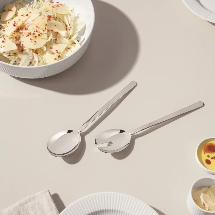 Shiny stainless steel salad servers