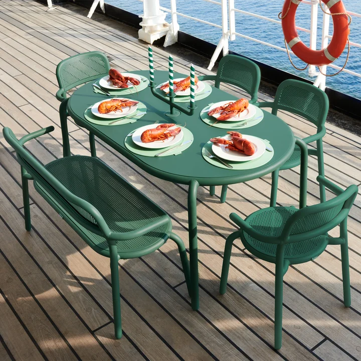 The Toní garden table with armchairs and bench from Fatboy on a ship's deck