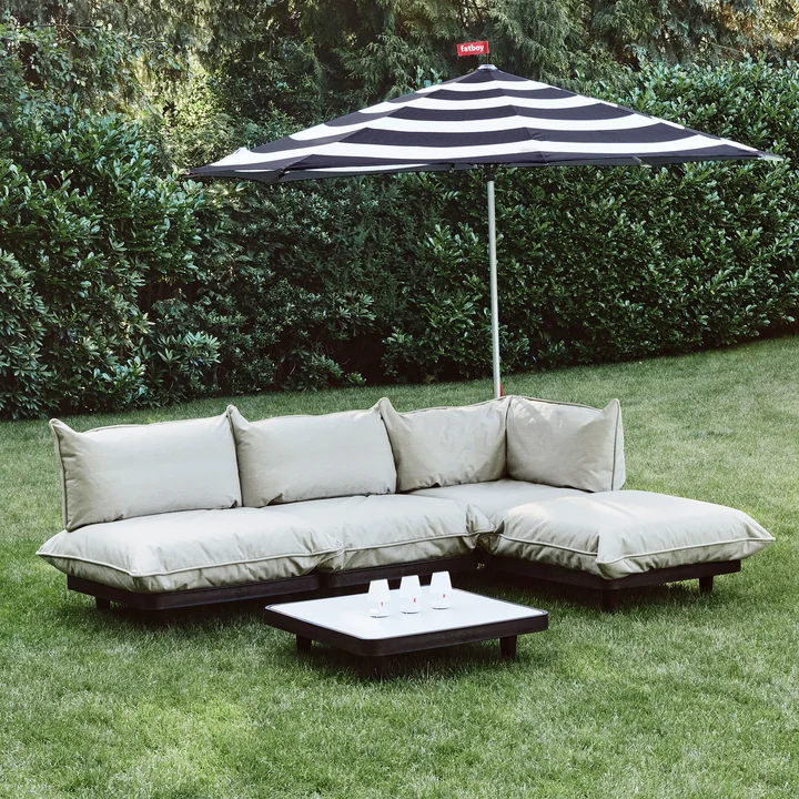 The Paletti Outdoor sofa from Fatboy on the lawn in the garden
