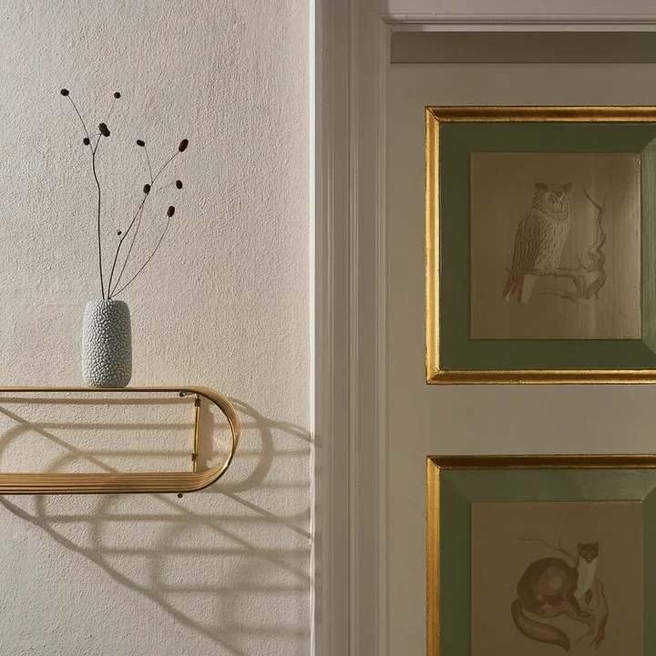 The Curva wall shelf from AYTM as wall decoration