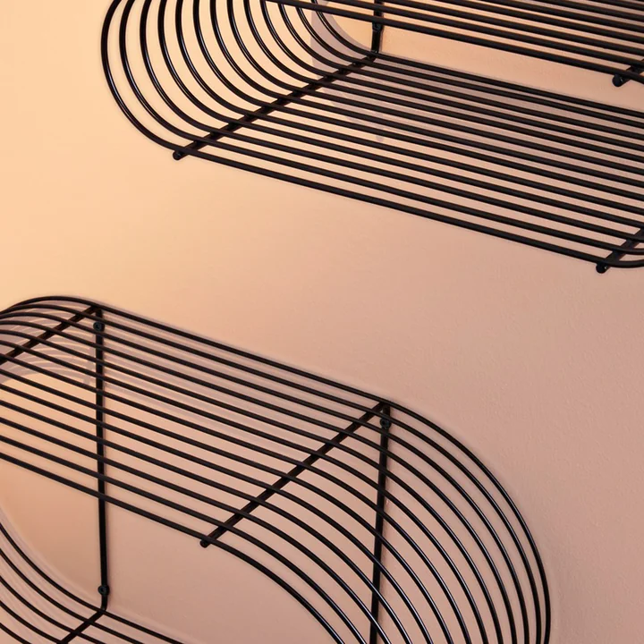 The Curva wall shelf from AYTM made from bent iron rods