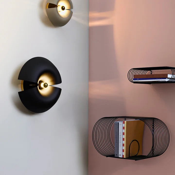 The light and airy Curva wall shelf from AYTM next to the Cycnus wall light