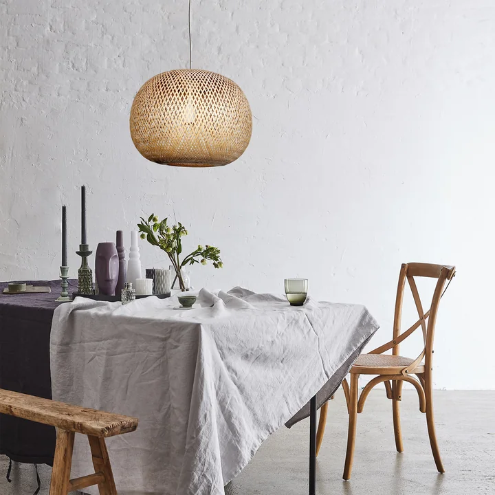The bamboo lampshade from the Collection above the dining table