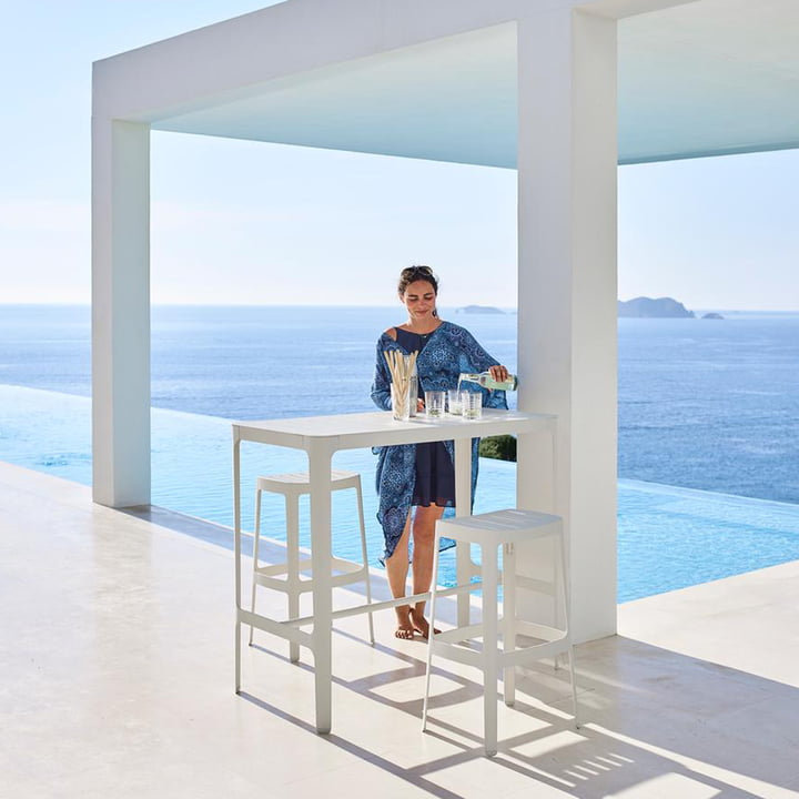 The Cut bar stool and bar table from Cane-line by the pool