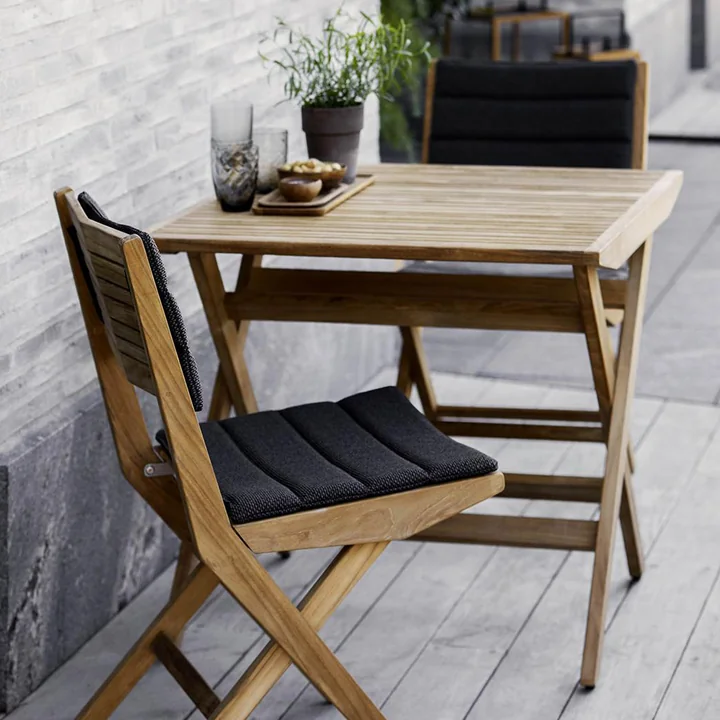 The Flip folding chair Outdoor from Cane-line with seat and back cushions