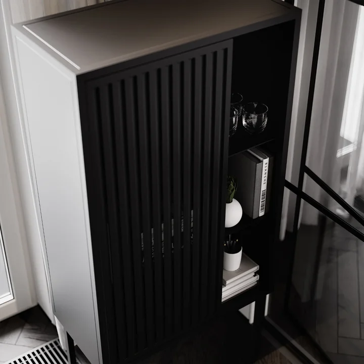 The cabinet from Nichba Design with vases and books