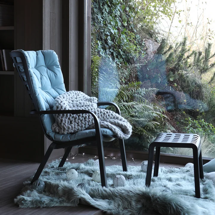 The Folio outdoor armchair with Poggio stool and seat cushion from Nardi in the house