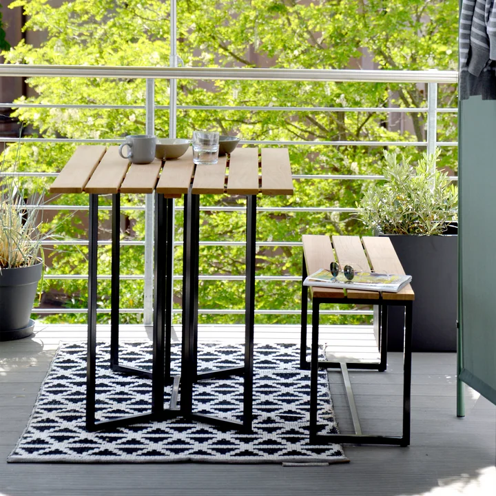 The Time folding table and bench from Jan Kurtz on the balcony