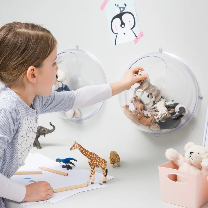 The Orion hanging display from Koziol filled with toys