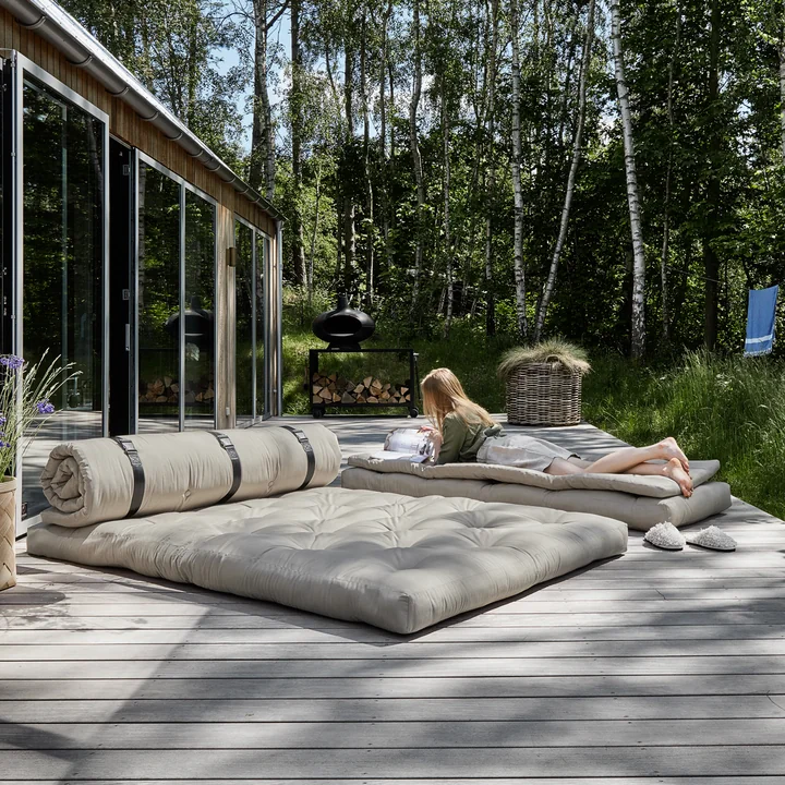 The Buckle Up OUT sofa from Karup Design as a bed on the terrace