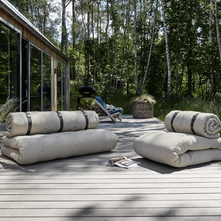 The Buckle Up OUT sofas from Karup Design on the wooden terrace