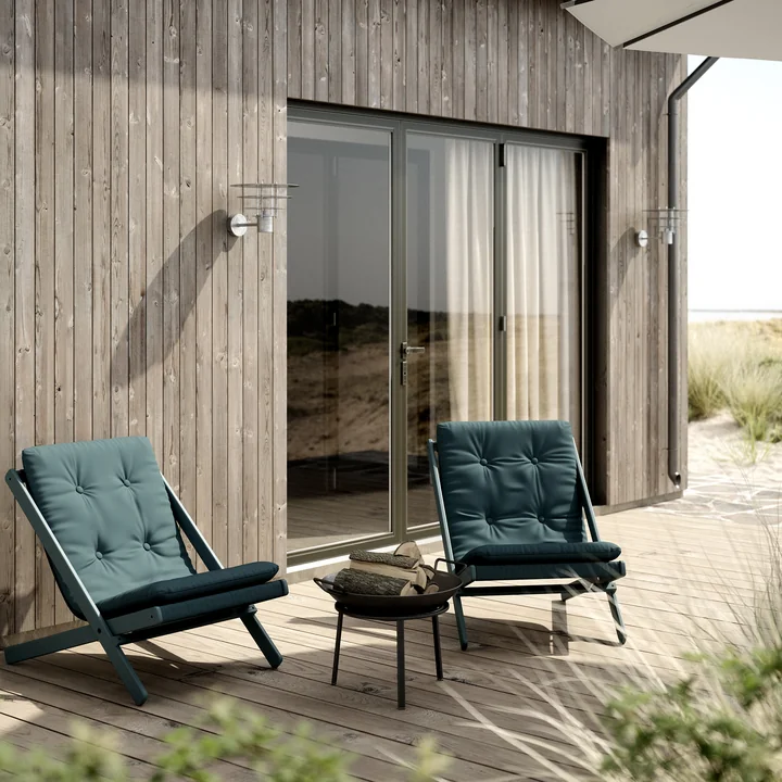 The Boogie folding chair from Karup Design on the maritime wooden terrace