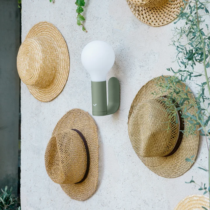 The cool Aplo outdoor light from Fermob hanging on the wall