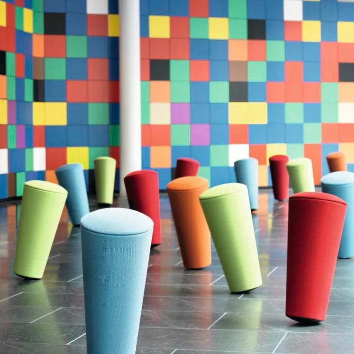 The Stand-Up stool from Wilkhahn in various bright colours