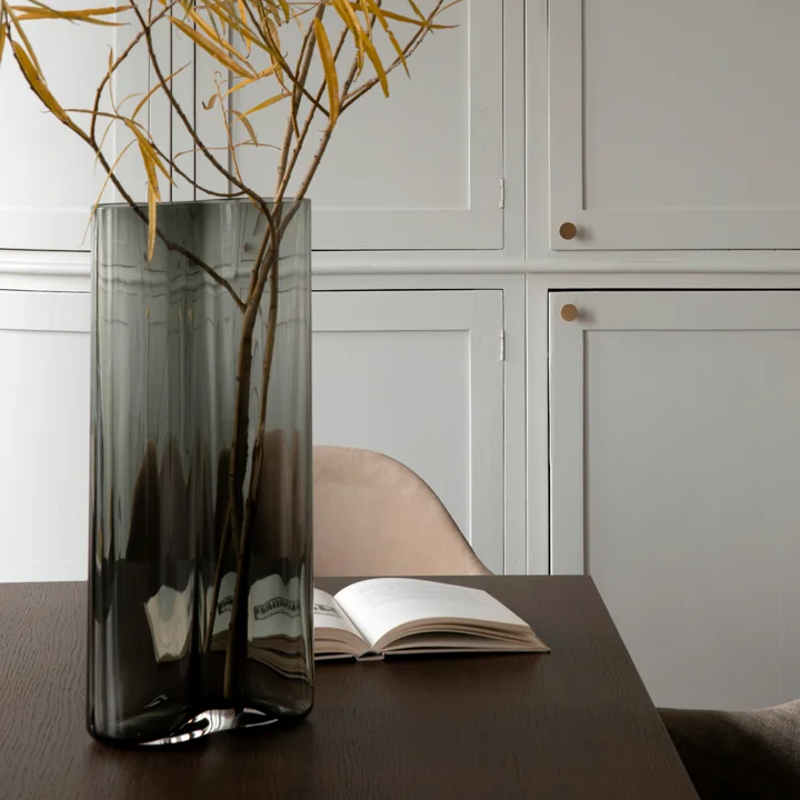 The Aer vase from Audo with bushes on the table