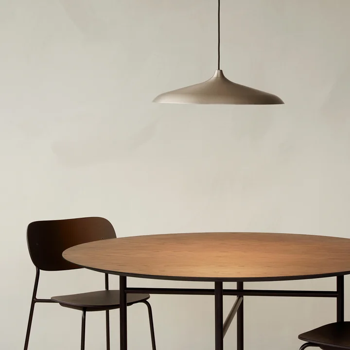 The Circular pendant lamp above the Snaregade table from Audo