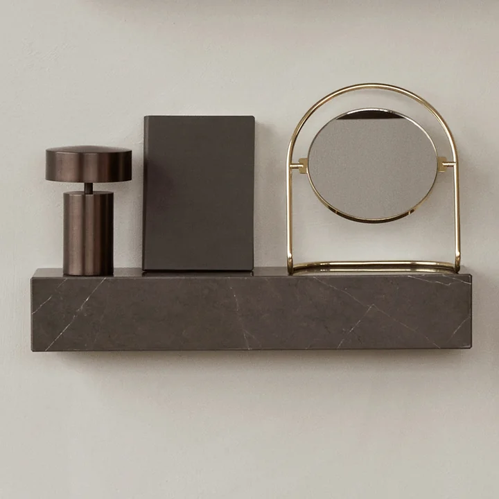 The Column table lamp and the Nimbus mirror on the Plinth wall shelf by Audo