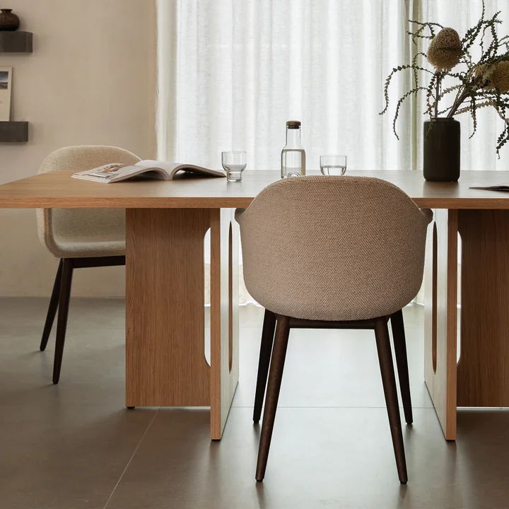 The Harbour Chair s from Audo with wooden legs and upholstered seat shell