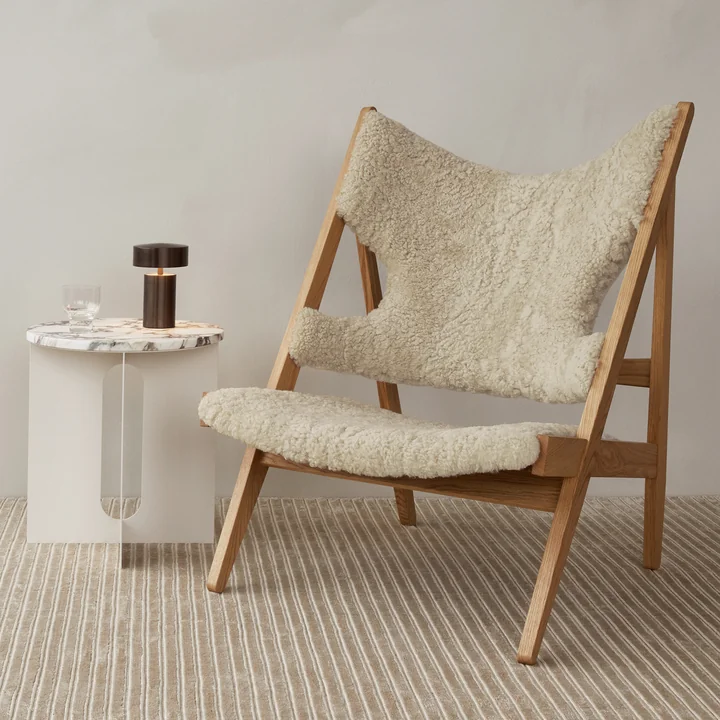 The cozy Knitting Chair from Audo next to the Androgyne side table