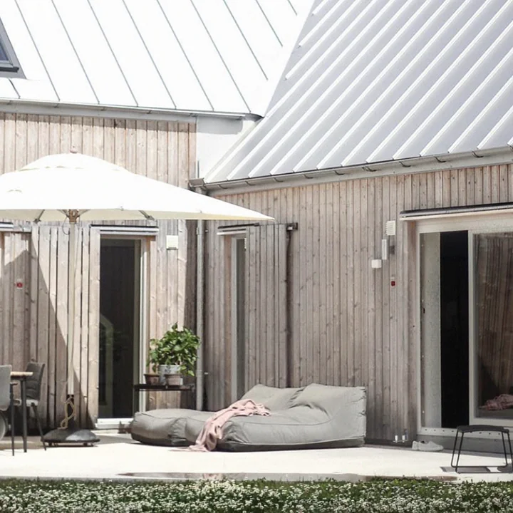 The resistant Storm Outdoor Lounge Chair from Norr11 on the terrace