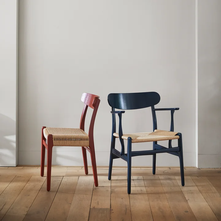 The CH26 armchair in north sea and the CH23 chair from Carl Hansen in falu