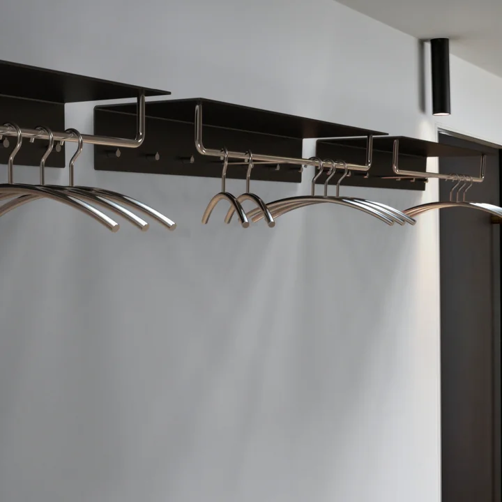 The Unu wall coat rack with hook and bar from Frost with slim hangers