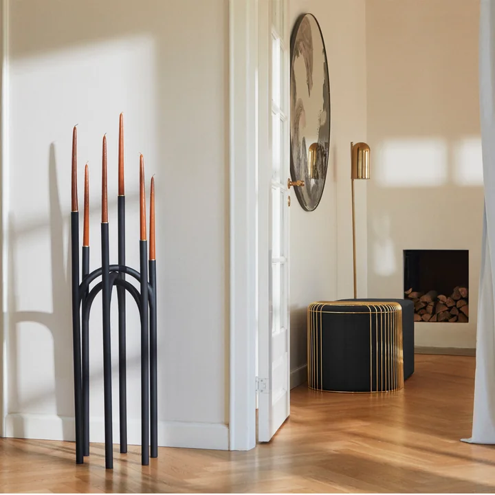 The Angui candleholder from AYTM on the floor in the living room