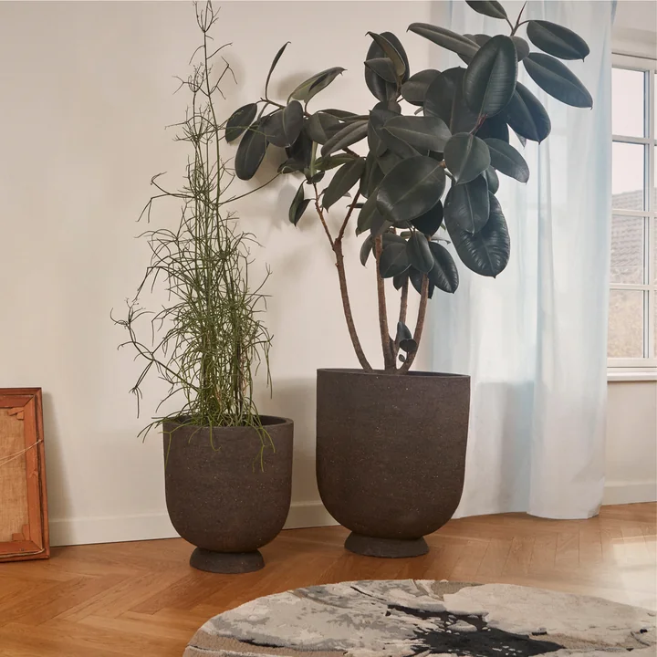 The Terra plant pot and vase from AYTM in different sizes in the living room