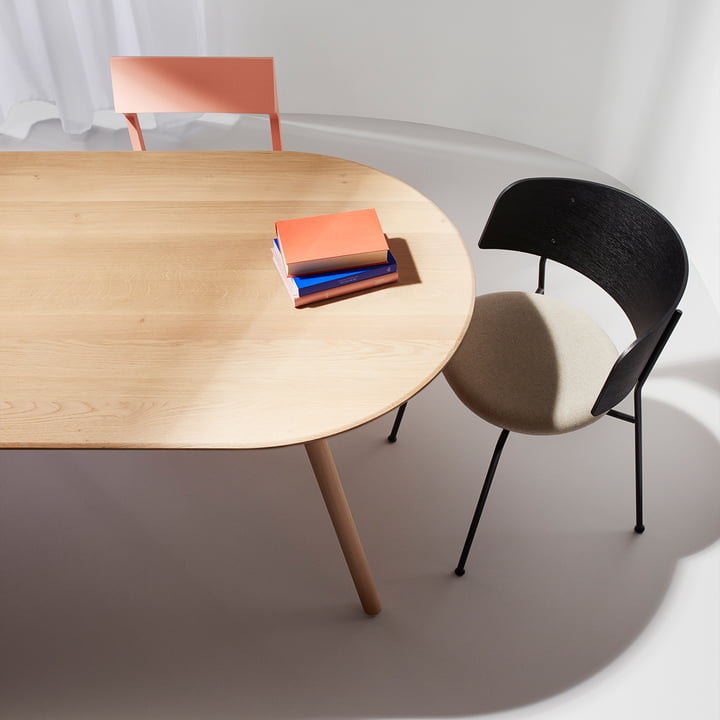 Slim wooden table for meals and conferences