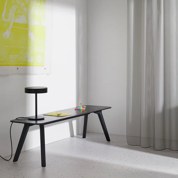 Elegant slim wooden bench as a color contrast