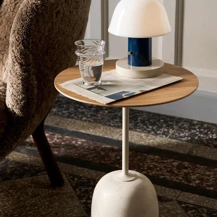 Discreet side table made from fine materials