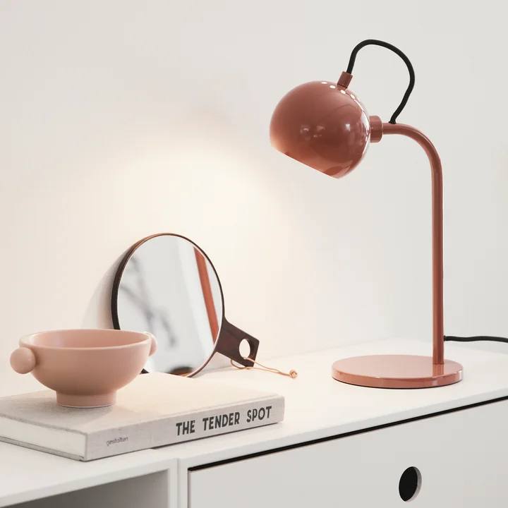 Slim designer lamp on the sideboard