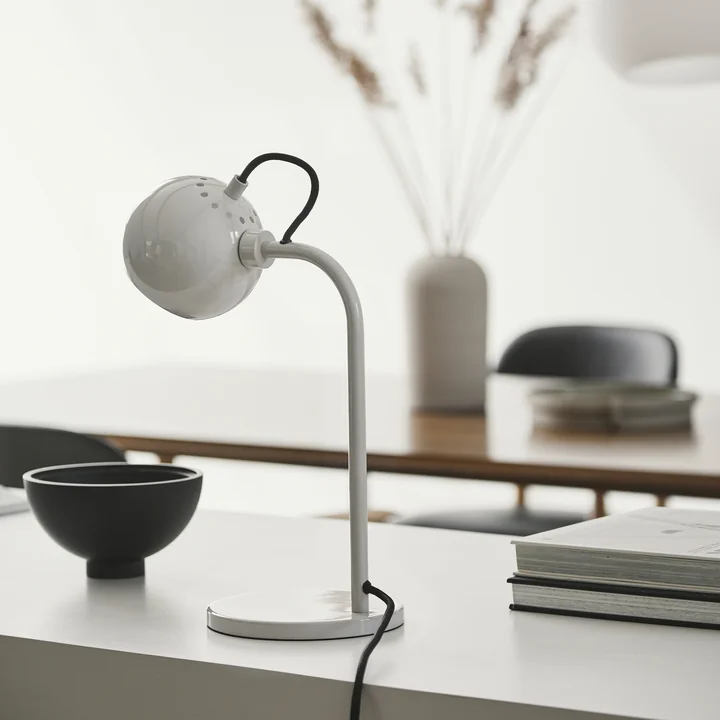 Designer lamp with rotating head