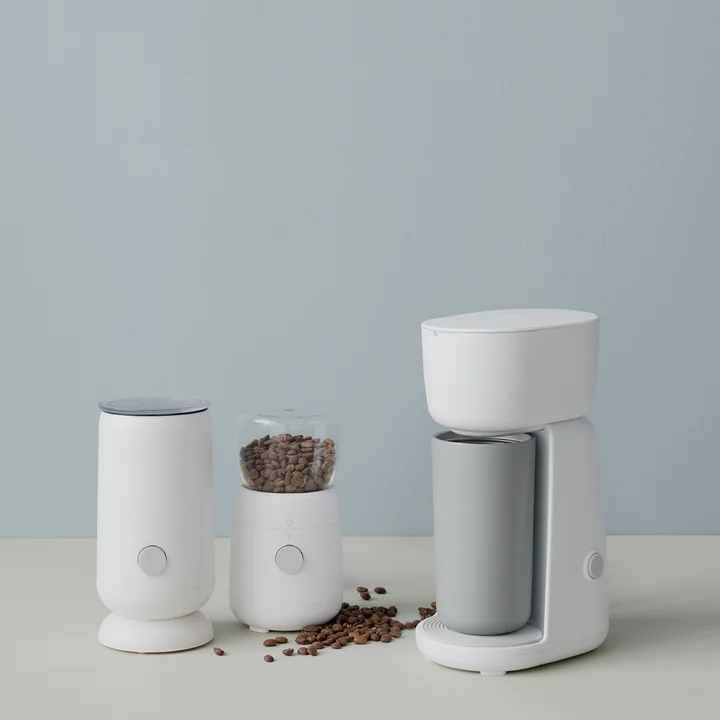 Milk frother, coffee grinder and coffee maker from Rig-Tig by Stelton in ambience view, white.